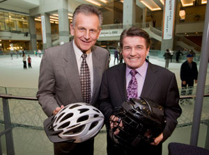 Federal Minister of State (Sport) Gary Lunn (right) and Senator Larry Smith announce funding for injury prevention in children and youth at the Atrium in Montreal, Quebec, Wednesday, March 16, 2011