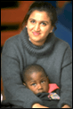 young woman holding a boy